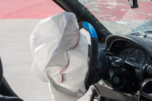 St. Clair Law Group | Auto Accident | Image of an exploded airbag from an auto crash